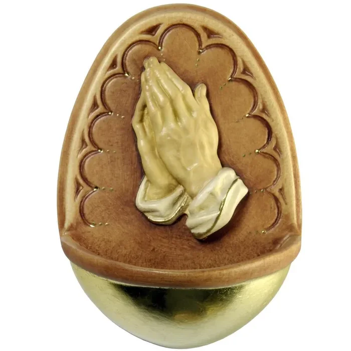 Acquasantiera con mani preganti